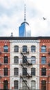 Old brick buildings contrast against modern steel skyscraper in New York City Royalty Free Stock Photo