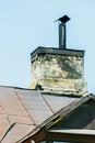 An old brick chimney of a house with a metal insert Royalty Free Stock Photo