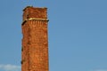 Old brick chimney isolated in the sky Royalty Free Stock Photo