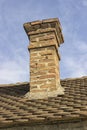 Old brick chimney with old tiles roof 2 Royalty Free Stock Photo