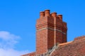 Chimney pots against a blue sky background Royalty Free Stock Photo