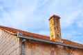Old brick chimney on the roof of a house Royalty Free Stock Photo