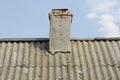 Old brick chimney on the roof of the house Royalty Free Stock Photo