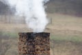 Old brick chimney and white smoke Royalty Free Stock Photo