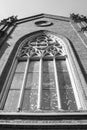 Old brick church with stained glass window. Black and white photo Royalty Free Stock Photo