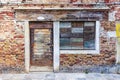 Old brick facade with boarded up windows Royalty Free Stock Photo