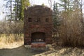 Old Brick Fireplace Remains in the Woods From an Old Ranch House Royalty Free Stock Photo