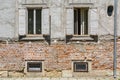 Old brick house facade with windows Royalty Free Stock Photo