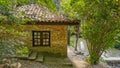 Old brick house with a small water stream