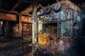 Old brick industrial stove in abandoned boiler room in factory