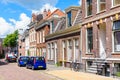 Old brick residential buildings along a street in a city centre on a sunny summer day Royalty Free Stock Photo