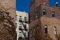 Old Brick Residential Buildings with Fire Escapes in Nolita of New York City