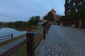 Old brick road to the historic center of Telc. The castle of Telc and the gate to the main square of Telc.