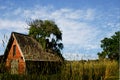 Old brick shed on farm land in Sonoma County California against blue and cloudy sky Royalty Free Stock Photo