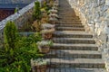 Old brick stairway, beautiful for walking on next to plants and nature, climbing stairs made of rock or cement, outdoor decoration