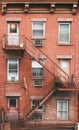 Old brick tenement house with fire escape, New York City, USA Royalty Free Stock Photo