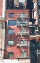 Old brick townhouse building with fire escape, New York City, USA Royalty Free Stock Photo