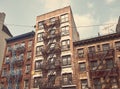Old brick townhouses with fire escapes, color toning applied, New York City, USA Royalty Free Stock Photo