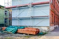 Old brick two-storey house reconstruction, wooden beams, scaffolding