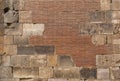 Old brick wall background. Ancient brickwork combined with big stone blocks and rocks.