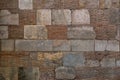 Old brick wall background. Ancient brickwork combined with big stone blocks and rocks.