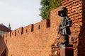 Old brick wall behind Maly Powstaniec statue in commemoration of the child soldiers