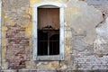 Old brick wall with broken window Royalty Free Stock Photo