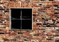 old brick wall with a broken window Royalty Free Stock Photo