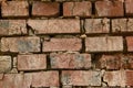 Old brick wall with crumbling bricks from time to time Royalty Free Stock Photo