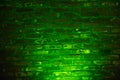 Old brick wall with emerald green neon lighting effect as background texture Royalty Free Stock Photo