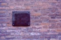 Old brick wall and empty metal plate Royalty Free Stock Photo