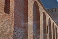 Old brick wall fort row arches perspective view