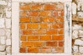 Old brick wall with a fully bricked window. Royalty Free Stock Photo