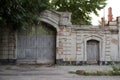 Old brick wall with a gate and a door Royalty Free Stock Photo