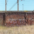 Old brick wall in front of the railway Royalty Free Stock Photo