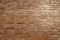 Old brick wall. Horizontal wide brick wall background. Vintage house facade