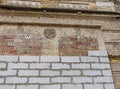 The old brick wall is lined with new modern bricks. The concept of updating something. Royalty Free Stock Photo