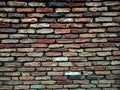 Old brick wall with lots of texture and colors. Royalty Free Stock Photo