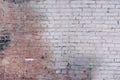 An old brick wall made of white and red bricks. Empty background of smooth rows of stones. B