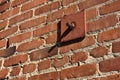 Old brick wall with a metal plate Royalty Free Stock Photo