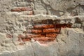 Old brick wall with peeling cement, Caused by an earthquake or a state of disrepair Royalty Free Stock Photo