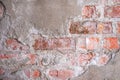 Old brick wall with peeling plaster, grunge background. Royalty Free Stock Photo