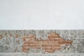 Old brick wall with peeling plaster, grunge background. Copy  for graphic display montage. Royalty Free Stock Photo