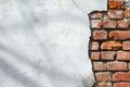 Old brick wall with peeling plaster, grunge background. Royalty Free Stock Photo