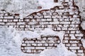 Old brick wall with peeling plaster, grunge background Royalty Free Stock Photo