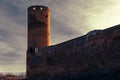An old brick wall and a round castle tower Royalty Free Stock Photo
