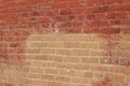 Old shabby chic pink and beige color brick wall texture with a blotchy abstract look Royalty Free Stock Photo