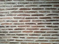 Old brick wall texture background. Front horizontal view of masonry wall made of red bricks and white lime mortar