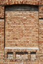 Old brick wall for texture or background, red and brown color, architectural elements as a brick filled window Royalty Free Stock Photo