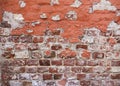 Old brick wall texture background with worn off paint